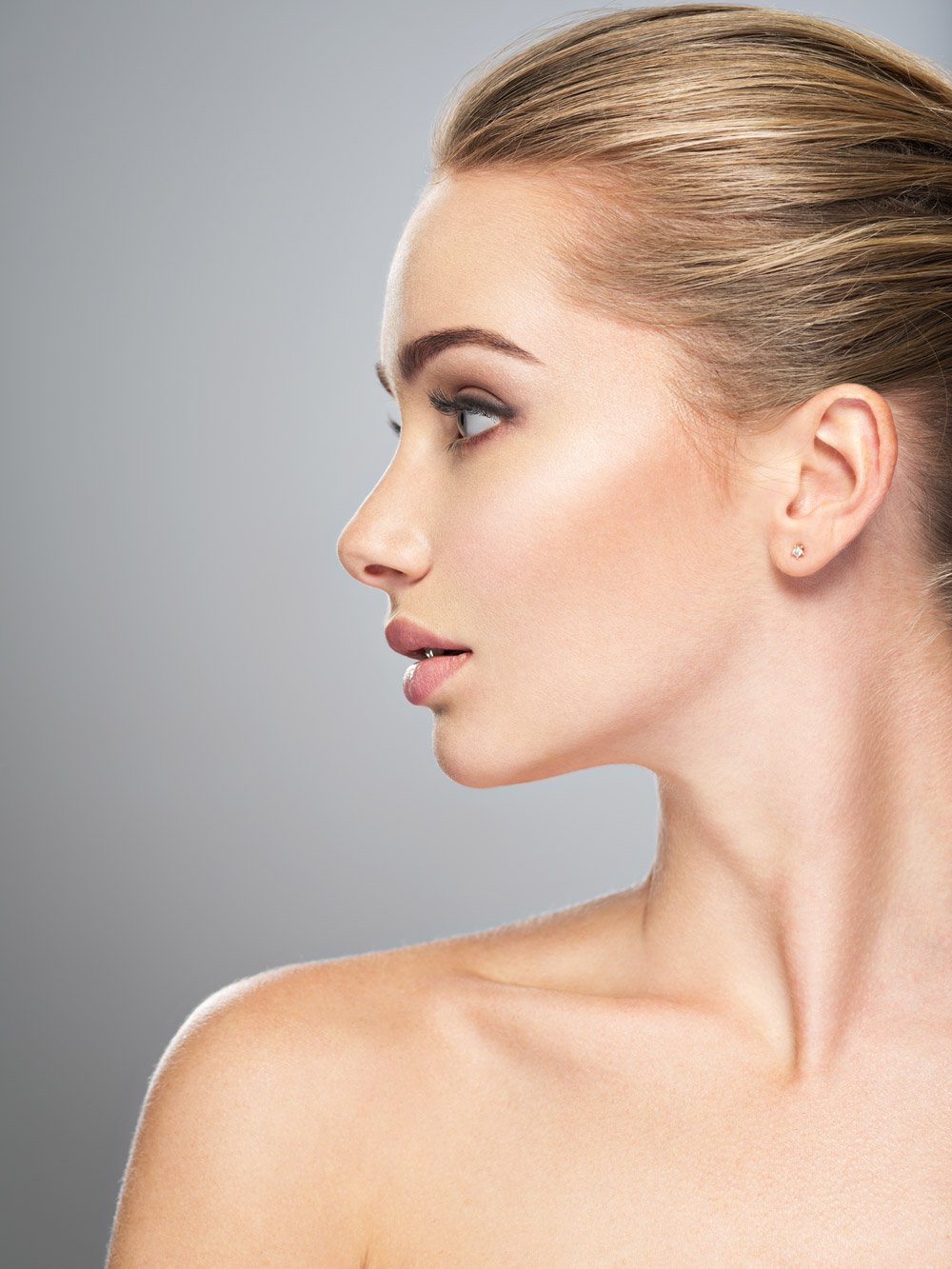Profile face of young woman, skin care treatment. Side view of beautiful girl with healthy skin of the face